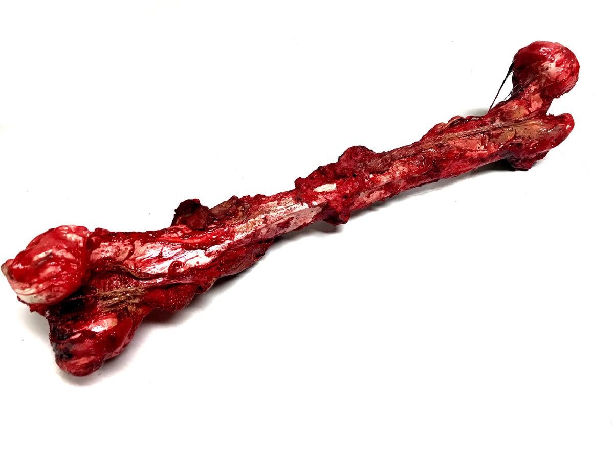 Bloody, Grisly Femur Bone Special Effects Prop with Realistic Skin and Gore - Prop Money Inc.