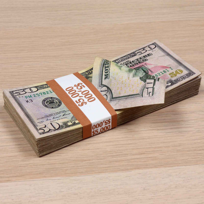 Stack of RealAged $50 prop money bills with full print detail